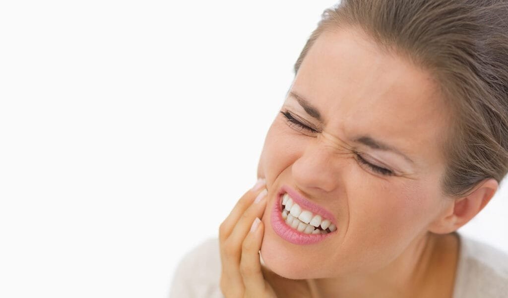 Noticing Tooth Sensitivity? 9 Likely Causes and How to Help san diego dental patient with sensitive teeth